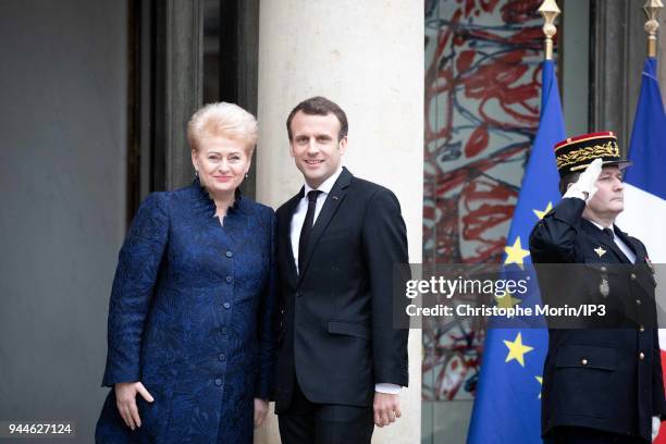 French President Emmanuel Macron welcomes Lituania President Dalia Grybauskaite at Elysee Palace on April 9, 2018 in Paris, France. The President...