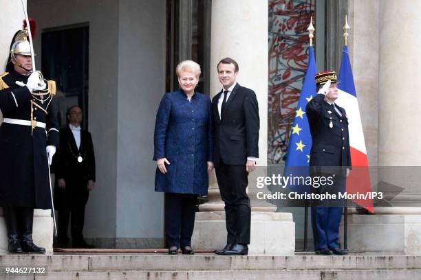 French President Emmanuel Macron welcomes Lituania President Dalia Grybauskaite at Elysee Palace on April 9, 2018 in Paris, France. The President...