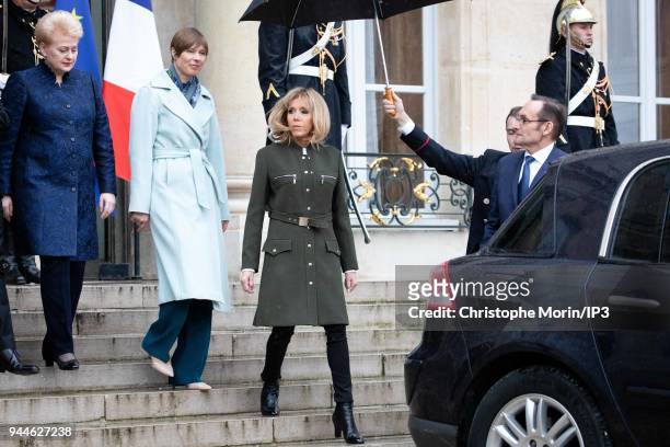 French president Emmanuel Macron's wife Brigitte Macron leaves the Elysee palace with Lituania president Dalia Grybauskaite and Estonia president...