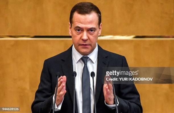 Russia's Prime Minister Dmitry Medvedev delivers a speech at the lower house of Russian parliament, the State Duma in Moscow on April 11, 2018.