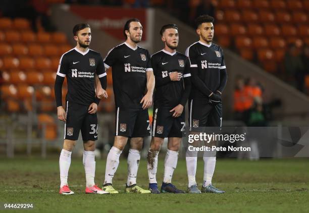 Jack Bridge, John-Joe O'Toole, Matt Grimes and Daniel Powell of Northampton Town line up to defend a free kick during the Sky Bet League One match...