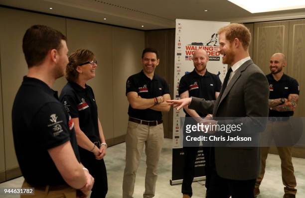 Prince Harry meets participants of the 'Walk Of America' during the launch of the event at Mandarin Oriental Hyde Park on April 11, 2018 in London,...