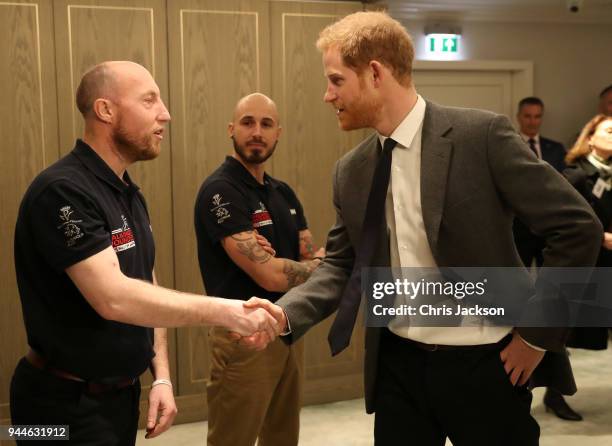 Prince Harry meets participants of the 'Walk Of America' during the launch of the event at Mandarin Oriental Hyde Park on April 11, 2018 in London,...