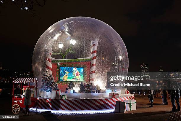 Fans gathered for a festive high definition screening of The Grinch in a giant snow globe on the South Bank on December 14, 2009 in London, England....