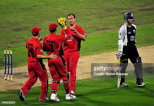 Matthew Weeks of the Redbacks is congratulated after getting the wicket of Chris Rogers of the Bushrangers during the Ford Ranger Cup match between...