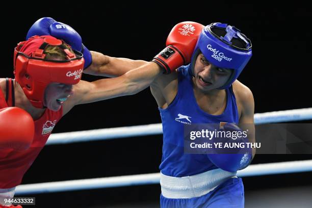 England's Lisa Whiteside fights India's Pinki Rani during their women's 51kg category quarter-final boxing match during their 2018 Gold Coast...