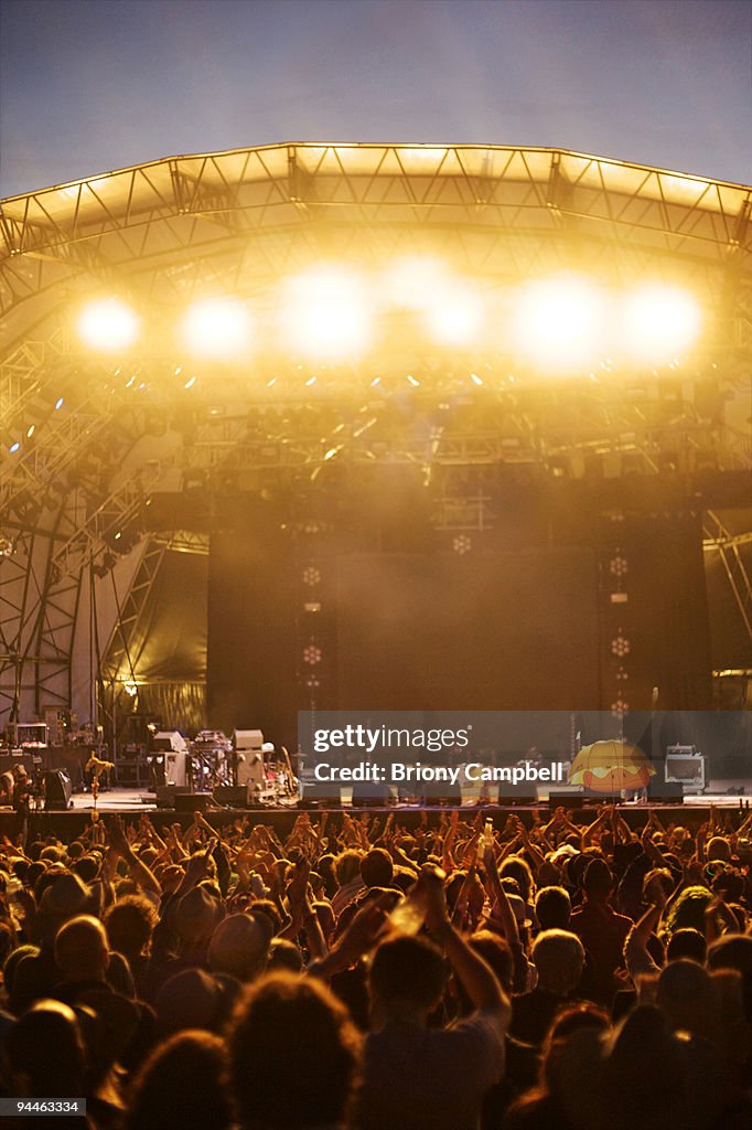 Crowd clapping at empty stage