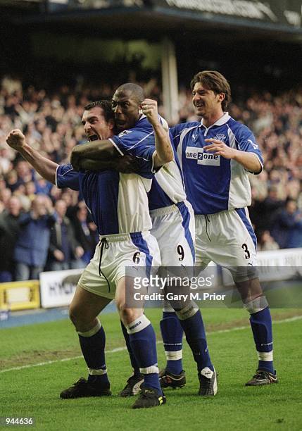 Everton players Alessandro Pistone and Kevin Campbell help celebrate David Unsworth penalty kick during the FA Carling Premiership match against...