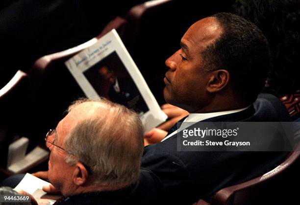 Simpson listens to the funeral service for the late Johnnie Cochran at the West Angeles Cathedral in Los Angeles, California. April 6, 2005