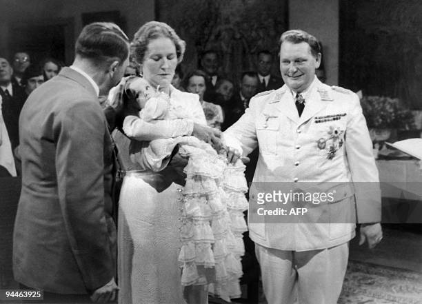 German nazi Chancellor Adolf Hitler attends Hermann and Emmy Goering's daughter Edda baptism in Carinhall on November 4, 1938. Hitler was Edda's...