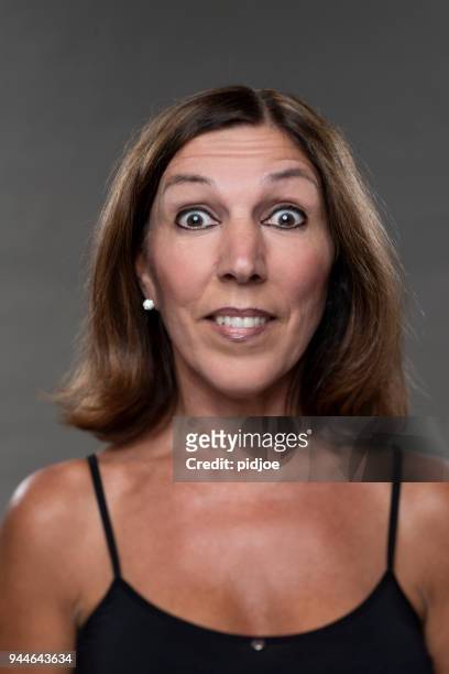 happy surprised portrait of real woman - cheesy grin stock pictures, royalty-free photos & images