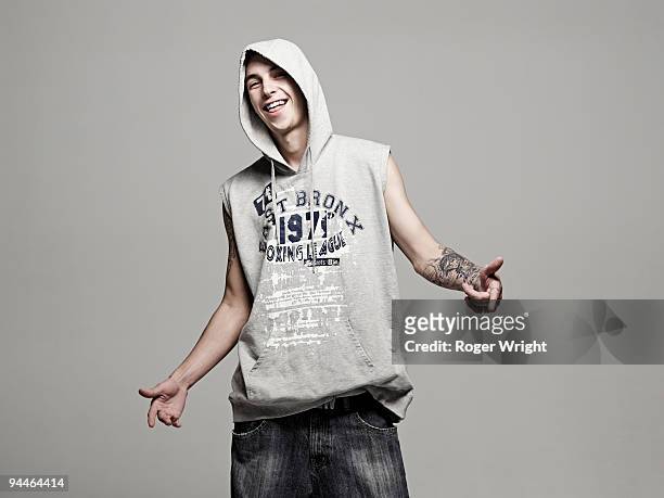 young man wearing a hoody and smiling - uomo incappucciato foto e immagini stock