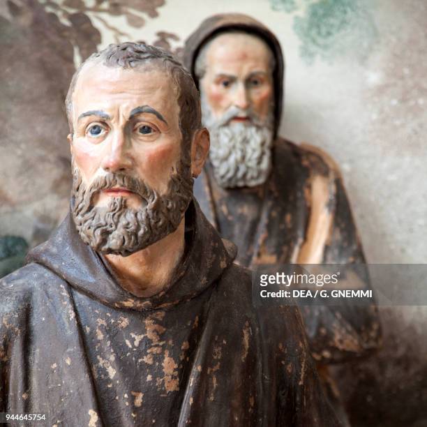 The friars discussing the strictness of Francis' Rule, detail of The Franciscan Rule approved by Jesus, polychrome terracotta statues by Cristoforo...