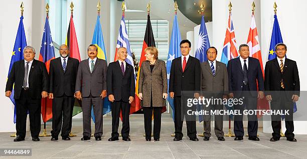 German Chancellor Angela Merkel poses for a group picture with the leaders of the Pacific island nations prior to a meeting on December 15, 2009 at...