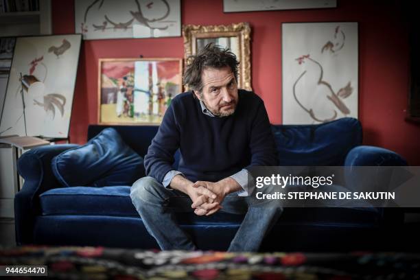 French actor Edouard Baer poses during a photo session at his home in Paris on April 9, 2018. - Baer has been named the master of ceremonies for the...