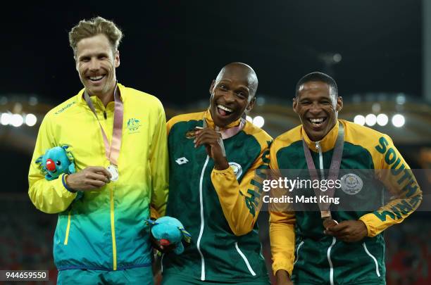 Silver medalist Henry Frayne of Australia, gold medalist Luvo Manyonga of South Africa and bronze medallist Ruswahl Samaai of South Africa pose...