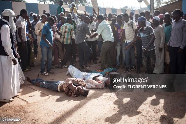 Graphic content / Residents of the mainly Muslim PK5 neighbourhood lay out the bodies of victims of the April 10 clashes during a demonstration in...