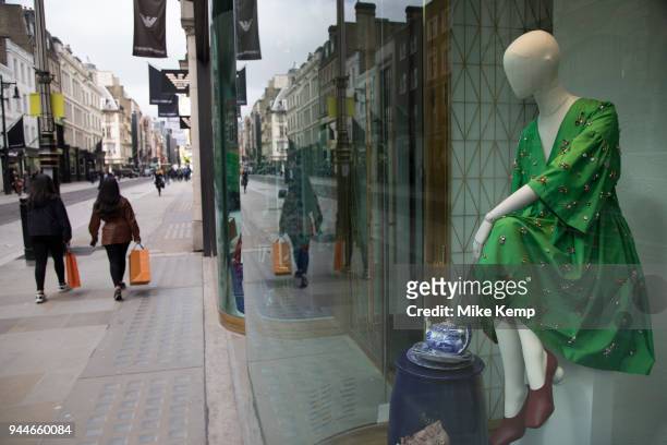 Exclusive clothes shop window for Mulberry on New Bond Street in Mayfair, London, England, United Kingdom. Bond Street is one of the principal...