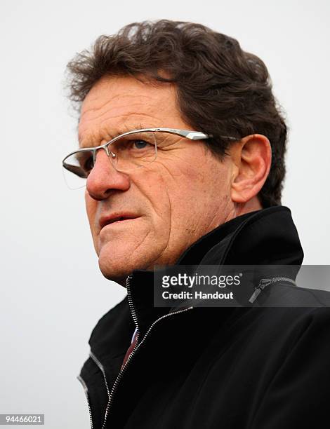 In this handout image provided by The FA, Fabio Capello, England Manager, talks to the media after opening the £11million community football facility...
