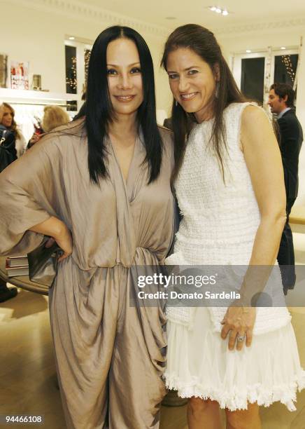 Eva Chow and Katherine Ross attend The World in Vogue: Oscar de la Renta Book Signing Party with Hamish Bowles on December 14, 2009 in Hollywood,...