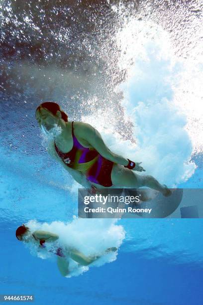 Jun Hoong Cheong and Pandelela Rinong Pamg of Malaysia compete in the Women's Synchronised 10m Platform Diving Final on day seven of the Gold Coast...