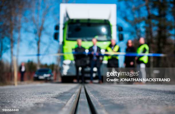 An electric rail, part of the first "eRoad" of its kind, an approximately two-kilometer-long electrified road, is pictured in front of a truck, on...