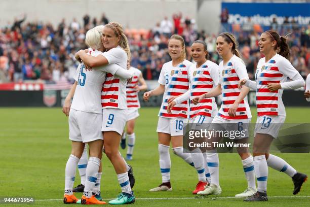 Megan Rapinoe of United States congratulates Lindsey Horan after a goal in the first half against the Mexico at BBVA Compass Stadium on April 8, 2018...