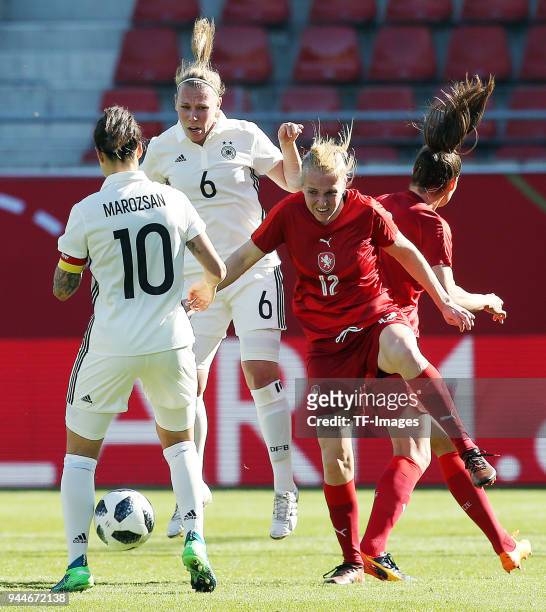 Dzsenifer Marozsan of Germany and Kristin Demann of Germany and Klara Cahynova of Czech Republic battle for the ball during the 2019 FIFA Womens...