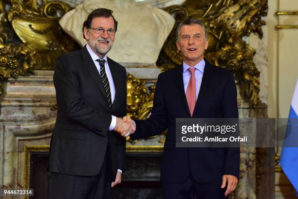 Prime Minister of Spain Mariano Rajoy shakes hands with President of Argentina Mauricio Macri during the first day of the official visit of the...