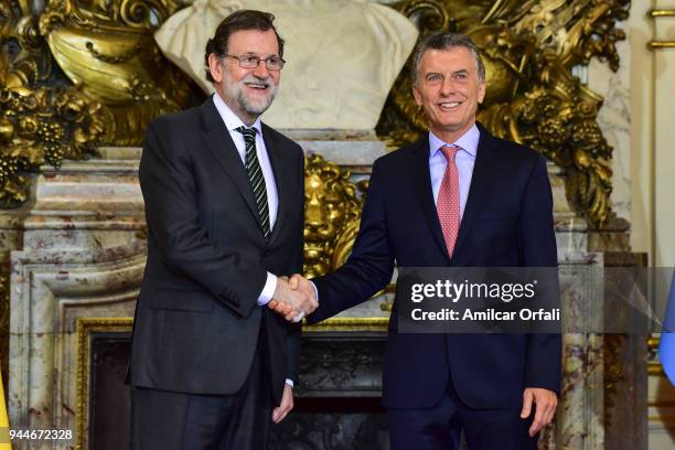 Prime Minister of Spain Mariano Rajoy shakes hands with President of Argentina Mauricio Macri during the first day of the official visit of the...