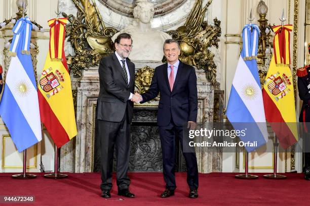 Prime Minister of Spain Mariano Rajoy shakes hands with President of Argentina Mauricio Macri during the first day of the official visit of the...