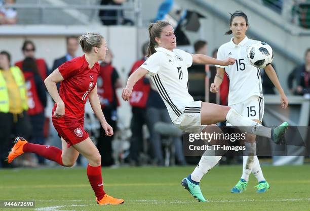 Tereza Krejcirikova of Czech Republic and Melanie Leupolz of Germany and Sara Doorsoun of Germany battle for the ball during the 2019 FIFA Womens...