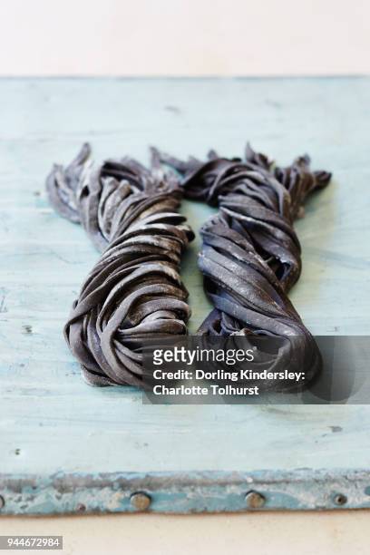 dough sorghum squid ink 1 - squid ink pasta stock pictures, royalty-free photos & images
