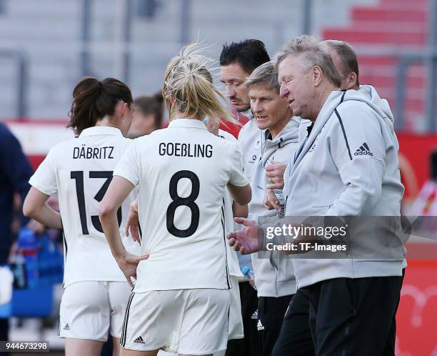 Sara Daebritz of Germany and Lena Goessling of Germany speak with Head coach Horst Hrubesch of Germany during the 2019 FIFA Womens World Championship...
