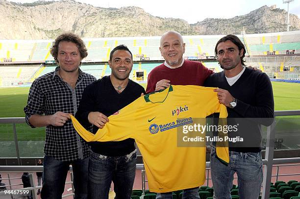 Players of US Citta di Palermo Fabrizio Miccoli and Giovanni Tedesco and singers Matteo Becucci and Enrico Ruggeri present the official jersey during...