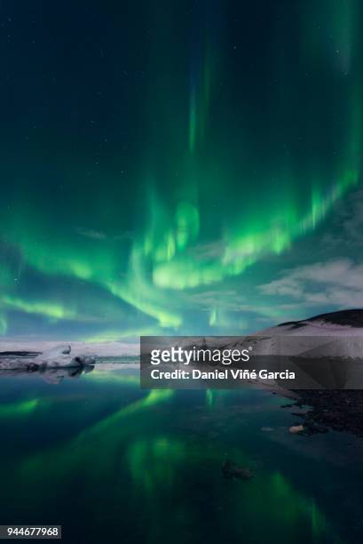 aurora borealis or northern lights, iceland - iceland aurora stock pictures, royalty-free photos & images