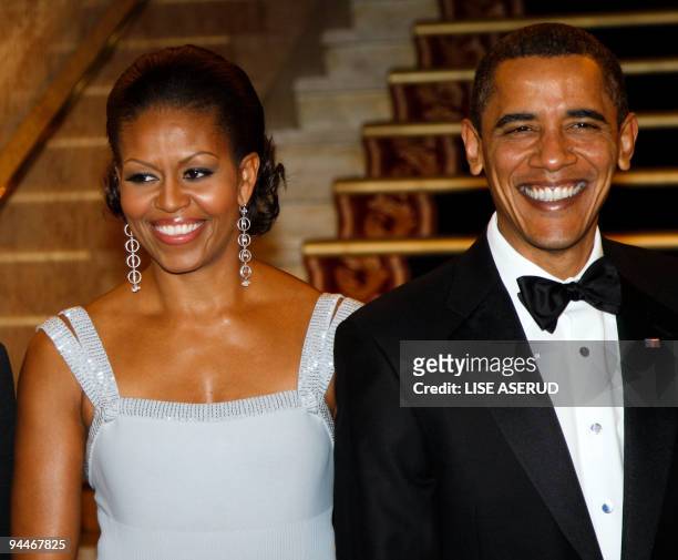 President and Nobel Peace Prize laureate Barack Obama and First Lady Michelle Obama arrive for the Nobel Banquet in Oslo on December 10, 2009. Obama...