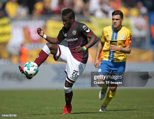 Moussa Kone of Dynamo Dresden and Mirko Boland of Eintracht Braunschweig battle for the ball during the Second Bundesliga match between Eintracht...