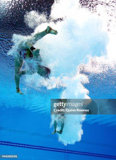 Jun Hoong Cheong and Pandelela Rinong Pamg of Malaysia compete in the Women's Synchronised 10m Platform Diving Final on day seven of the Gold Coast...
