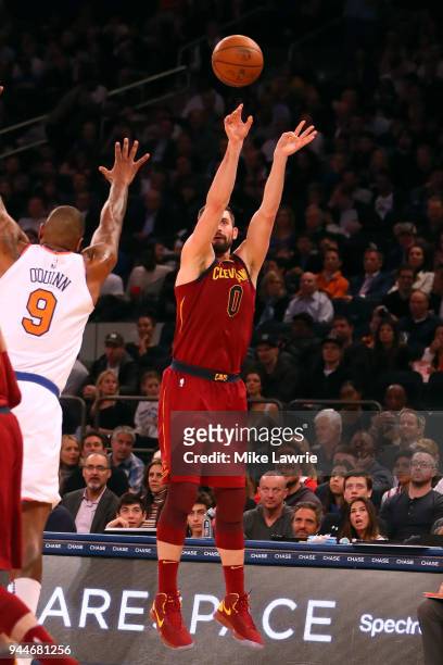 Kevin Love of the Cleveland Cavaliers shoots in the first half against Kyle O'Quinn of the New York Knicks at Madison Square Garden on April 9, 2018...