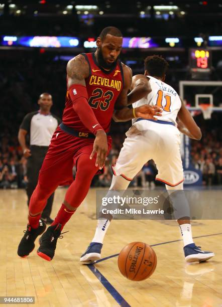 LeBron James of the Cleveland Cavaliers dribbles against Frank Ntilikina of the New York Knicks in the first half at Madison Square Garden on April...