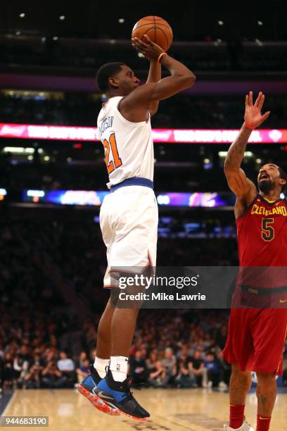 Damyean Dotson of the New York Knicks shoots against JR Smith of the Cleveland Cavaliers in the fourth quarter at Madison Square Garden on April 9,...