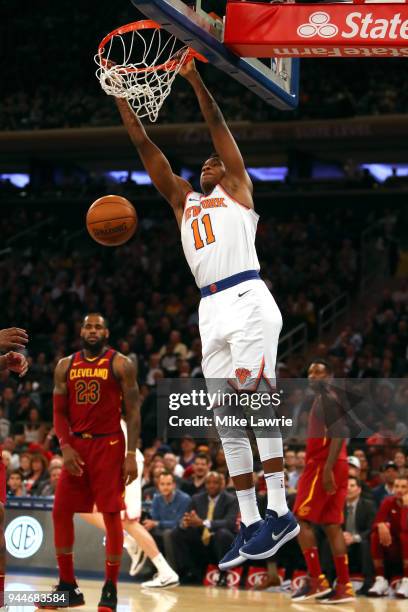 Frank Ntilikina of the New York Knicks goes up for a dunk in the second half against LeBron James of the Cleveland Cavaliers at Madison Square Garden...