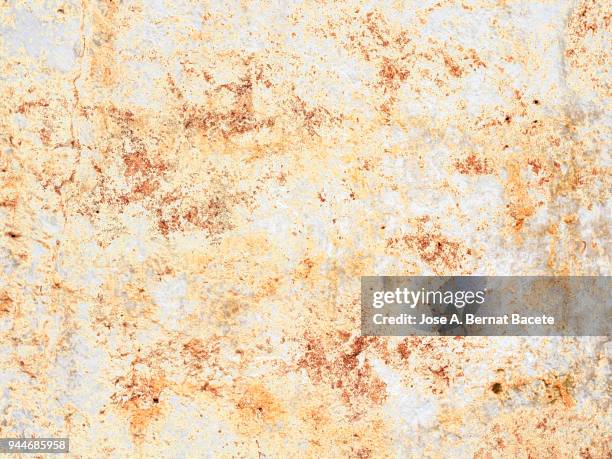 complete setting of a facade of a cement wall with stones  ancient and spoil in the time. high resolution photography. - adobe texture stockfoto's en -beelden