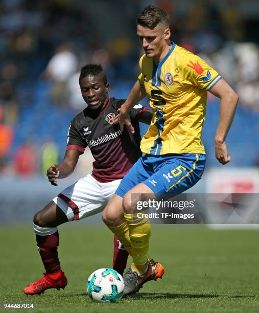 Moussa Kone of Dynamo Dresden and Gustav Valsvik of Eintracht Braunschweig battle for the ball during the Second Bundesliga match between Eintracht...