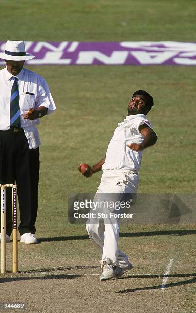 Muttiah Muralitharan of Sri Lanka bowls the ball during the first test match against England played at the Galle International Cricket Stadium, in...