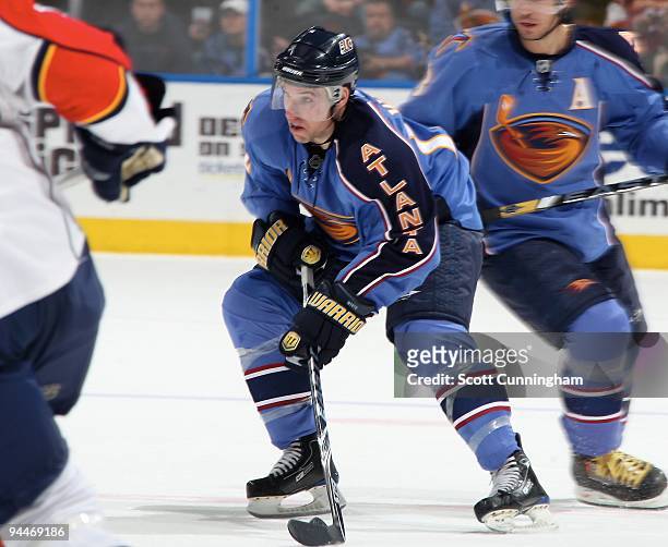 Todd White of the Atlanta Thrashers carries the puck against the Florida Panthers at Philips Arena on November 30, 2009 in Atlanta, Georgia.