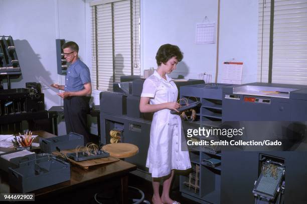Two Centers for Disease Control and Prevention employees working in the Division of Tuberculosis Elimination, 1962. Image courtesy Centers for...