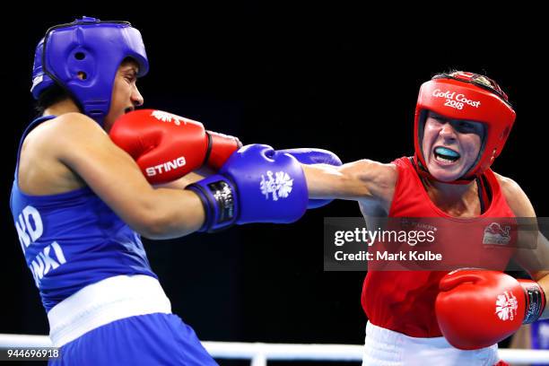 Lisa Whiteside of England and Pinki Rani of India compete in their WomenÕs 51kg Quarterfinal bout during Boxing on day seven of the Gold Coast 2018...