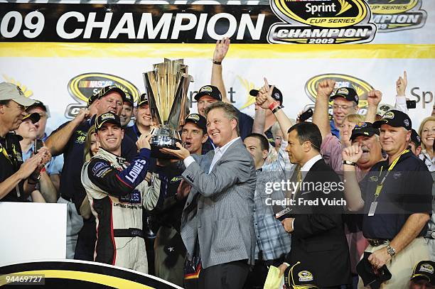 Ford 400: Jimmie Johnson victorious during trophy presentation by NASCAR CEO and chairman Brian France on Victory Lane after winning Sprint Cup...